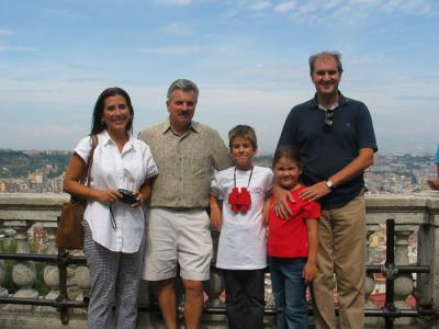 family poses high up over naples.JPG