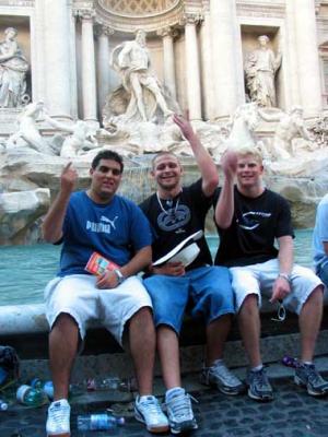 Tariq and his buddies throw coins in the Trevi Fountain.JPG