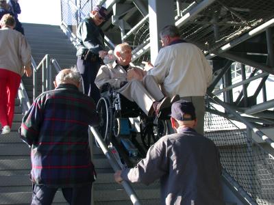 Dick Grimm goes up the stairwell. Loyd Anna and Bill Dehlinger gives Dick advice. Don Russell follows.