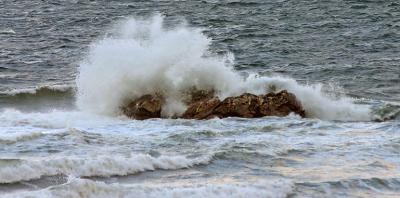 Waves driven by strong northwest winds pound the shore