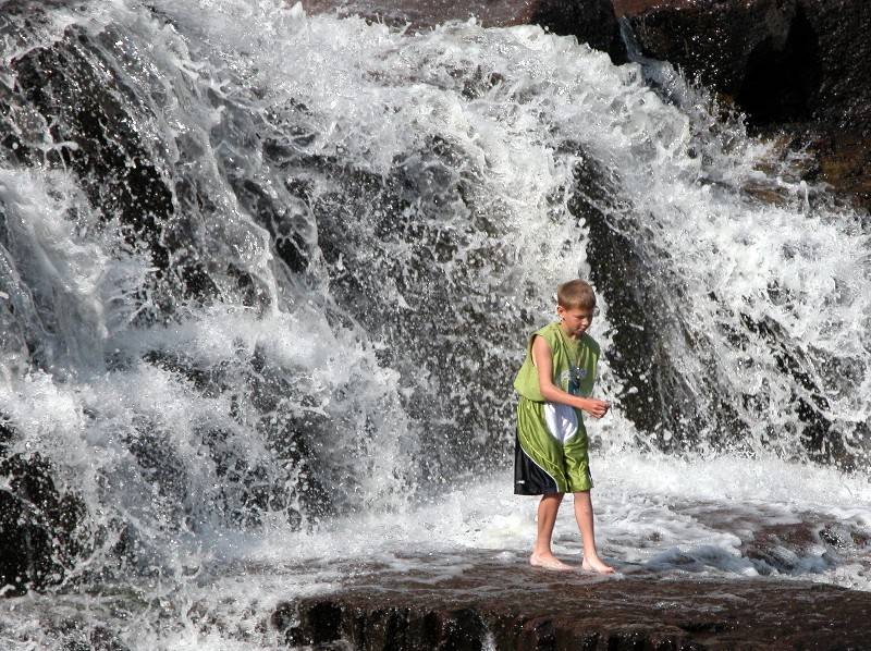 Youngster in the Falls