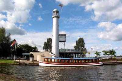 Lighthouse and lake tour boat