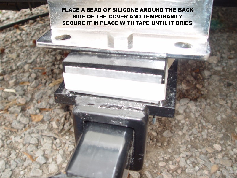HITCH COVER TAPED IN PLACE TO LET SILICONE CAULKING SETUP
