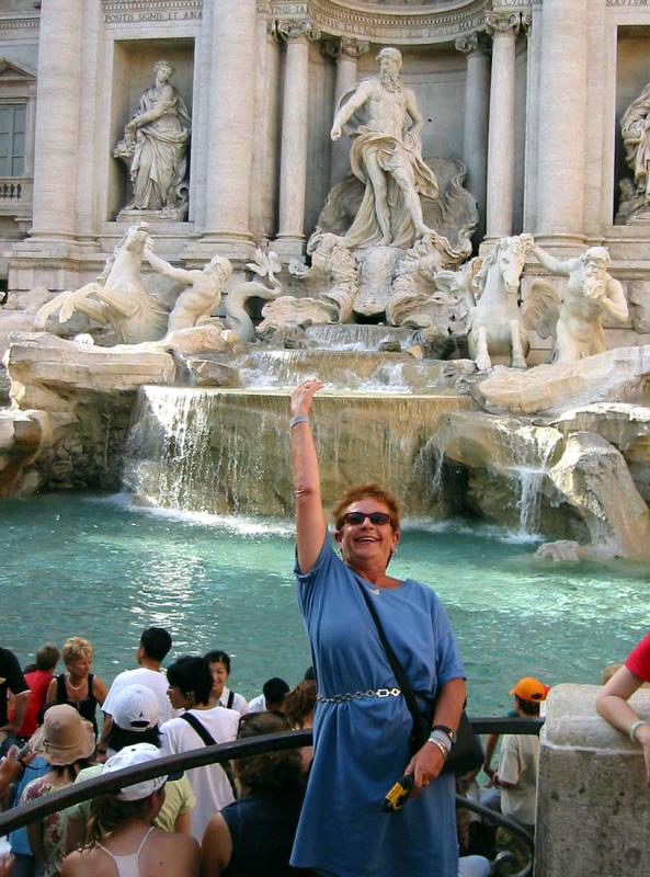Julia doing a mandatory toss at the Trevi Fountain