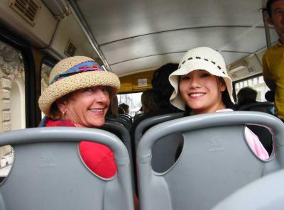 Julia and Oriell on London double-decker bus.