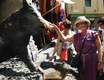Florence. Julia pets the bonze good-luck boar