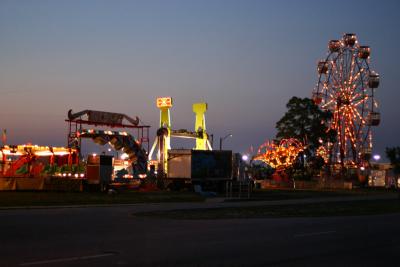 lighted green pillars. at the carny