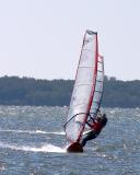 flying. two windsurfers