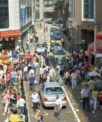 Cars and pedestrians in uneasy truce