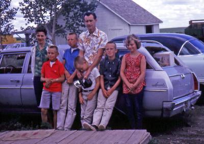 Anne, Donovan, Bill, Bud, Pat, and Joanne at farm; Diana, Sask., 1964
