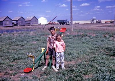 Chris and Lorraine at farm; Diana, Sask., 1965