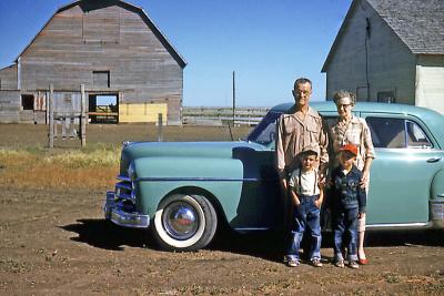 Bob, Glady, Steve, and Greg at Fred and Hattie's farm; Sask., 1953