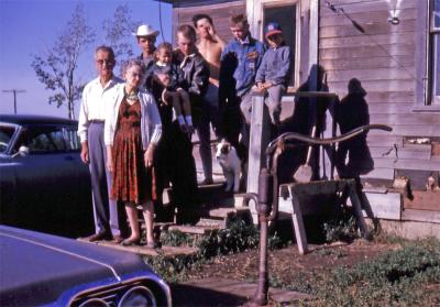 Bob, Gladys, Steve, Kevin and Lorraine, Greg, Terry, and Chris at farm; Diana, Sask., 1964