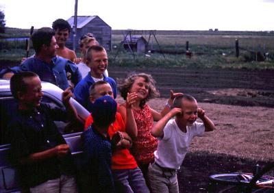 Greg, Steve, Terry, Bill, Tim, Chris, Donovan, Joanne, and Pat at farm; Diana, Sask.; 1964