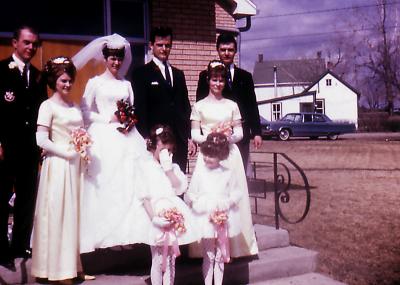 Kevin, bridesmaid, Donna, Greg, Steve, bridesmaid, Lorraine, and Cara Lee at Greg's wedding; Wilcox, Sask., 1968