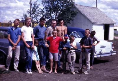 Bill, Terry, Lorraine, Steve, Kevin, Greg, Donovan, Chris, Pat, Tim, and Mike at farm; Diana, Sask., 1964