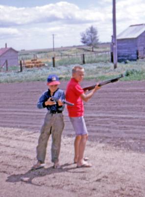 Chris and Donovan at farm; Diana, Sask., 1964