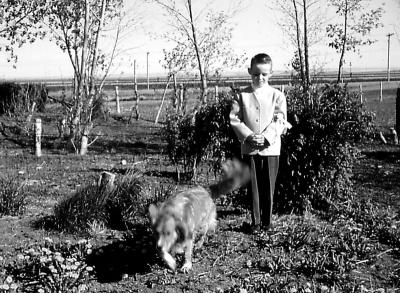 Mike and Rex at farm; Diana, Sask., 1960