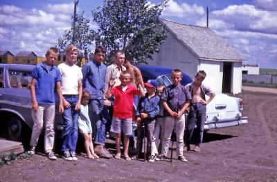 Bill, Terry, Lorraine, Steve, Kevin, Greg, Donovan, Chris, Tim, and Mike at farm; Diana, Sask., 1964