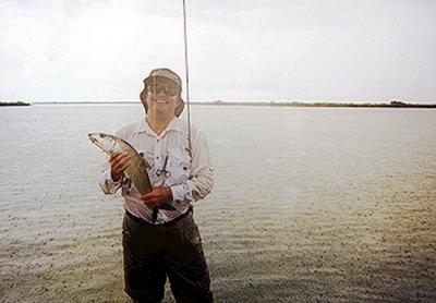 Mark Jacoby lands a huge bonefish....in the rain! Grand Bahama Island, May , 2002