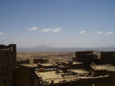 Woman (working) on rooftop in Thilla