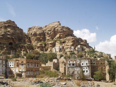 Shibam, with caves in the hills.