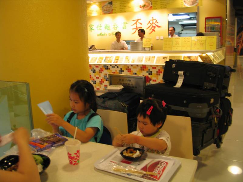 Stephanie & Melody at Food Court at HK ferry terminal to mainland China