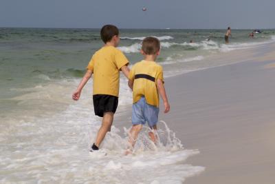 Brothers walking on the beach