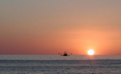 Shrimp boat at sunset