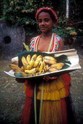 Girl offering Bananas