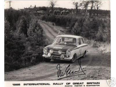 Vic Elford at the wheel of the Ford Cortina racing on dirt road 1966 International Rally of Great Britain.jpg