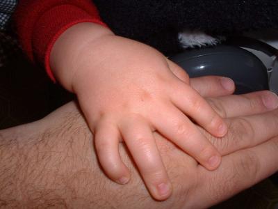 Max's hand on daddy's