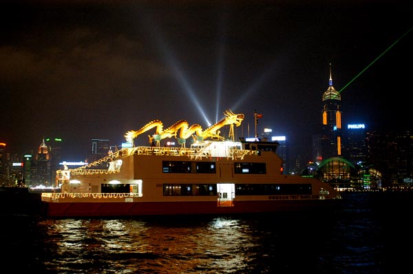 First Travel XXXII with a dragon cruising Hong Kong Harbour during the Laser & Light Show