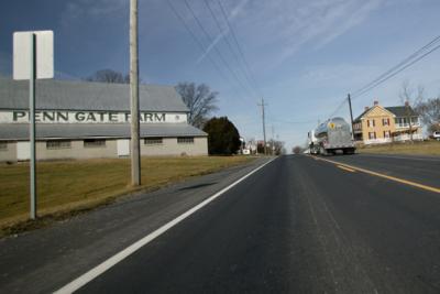 Milk Truck Passing Dairy Farm.jpg