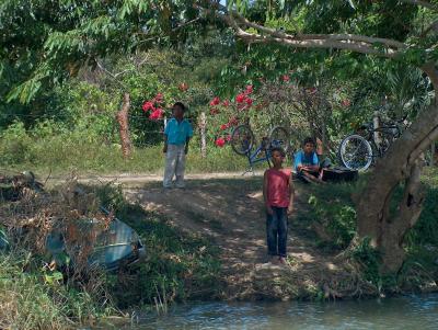 The Belizean children watch our riverboat fly past