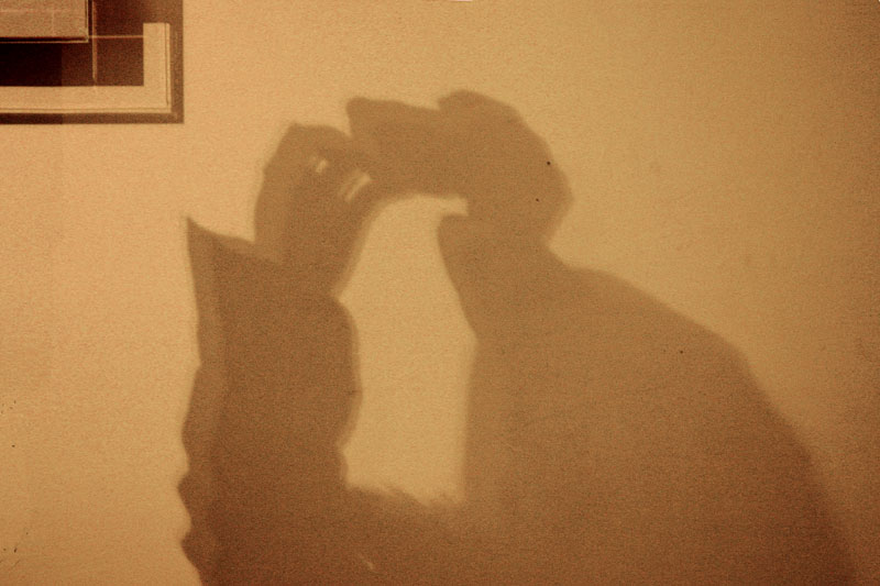 TAKING A PHOTO.........SCRATCHING THE DOG