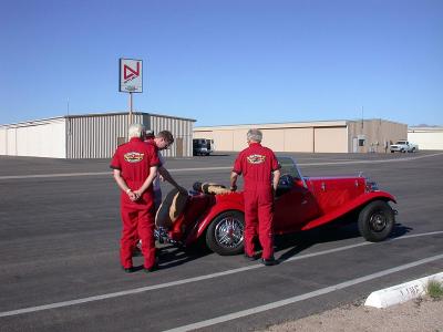 Red Baron pilots and red sports car