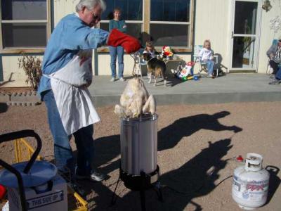 Frank proceeds to baptize the turkey