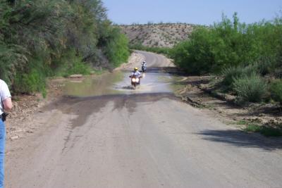 Low water crossing and very brave scooter rider