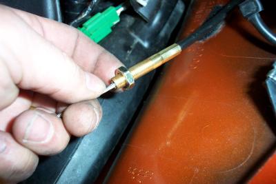 Replace the lock nut after you thread the cable into place