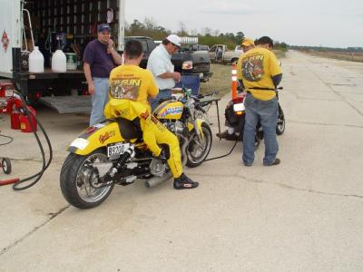 FILLING UP THE BIKE WITH SUNOCO RACING GAS, DON'T ASK THEM WHAT KIND OF MILEAGE THEY GET, AS THEY WILL JUST LAUGH