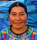market woman against blue, antigua, guatemala