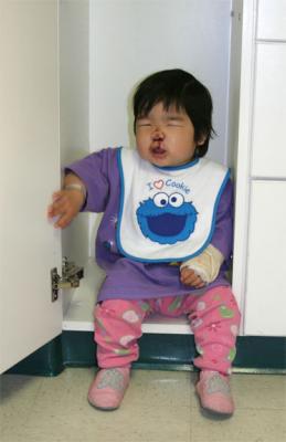 Trying to smile for the camera. Checking out the closet