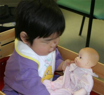 Playing with baby doll