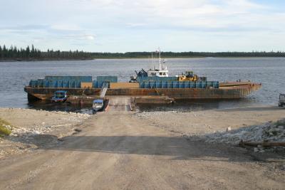 Barge tied up in front of Tug Nelson River at Moosonee