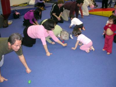 Grandma rolling small balloon with nose