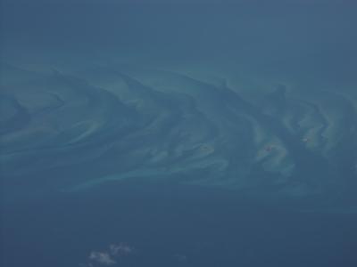 on the way home- cool view of wavy sandbars near the bahamas from plane (click for better view)