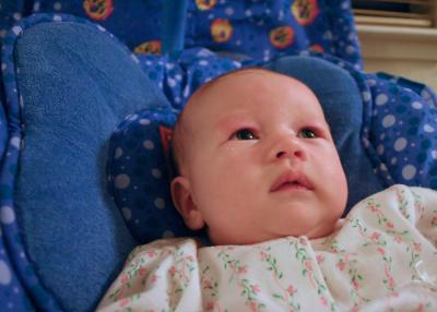 Emily hanging out in her swing. She sure likes to follow the mobiles arounds.