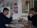 Housemates Derek and Cam playing cards in our kitchen.