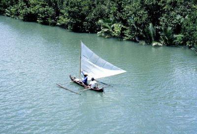 Outrigger sailing canoe